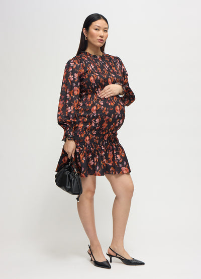 Cassie is 7 months pregnant and wearing a size Medium || blur floral pink
