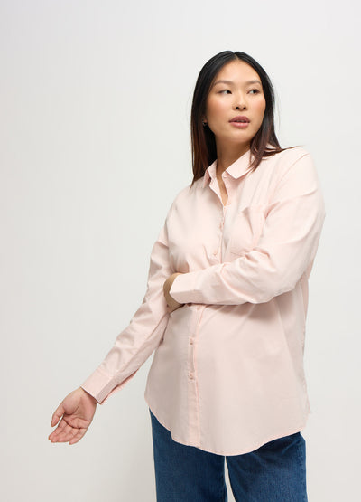 Cassie is 8 months pregnant and wearing a size medium || pink
