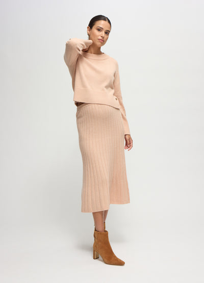 Talisia is 7 months pregnant and wearing a size small || champagne
