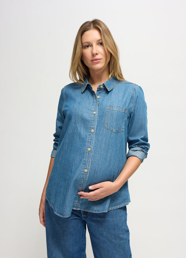 Wyomi is 5 months pregnant and wearing a size S || medium wash denim button down shirt