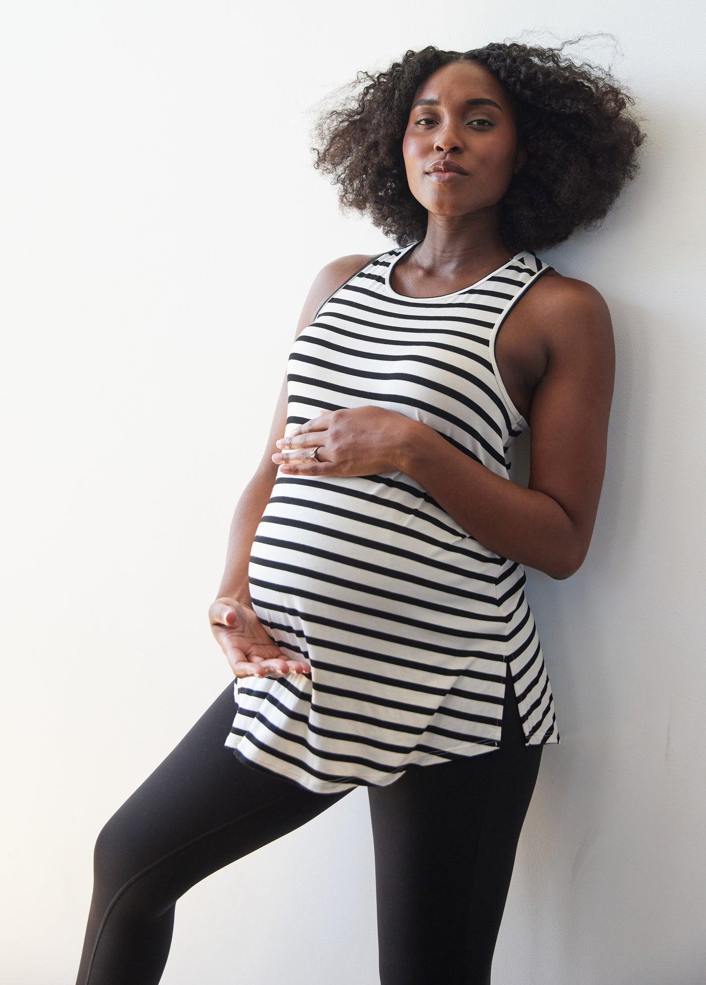 Desiree is 5’11", 8 months pregnant and wearing a size large||Black White Stripe